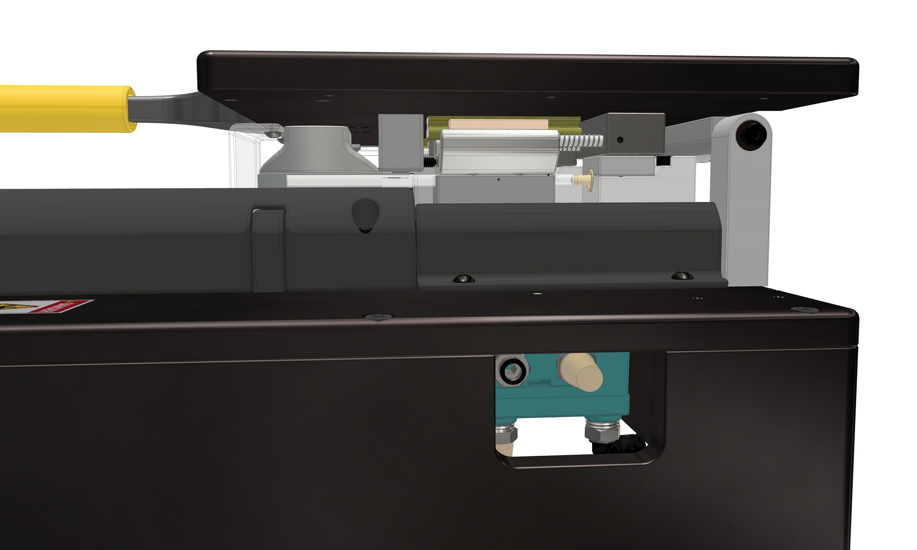 Side view of the station with the tool plate lowered, showing the yellow handle, a clamp cylinder with its coupling, and a pneumatic valve mounted inside the base cutout